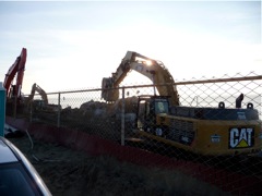 Three backhoes